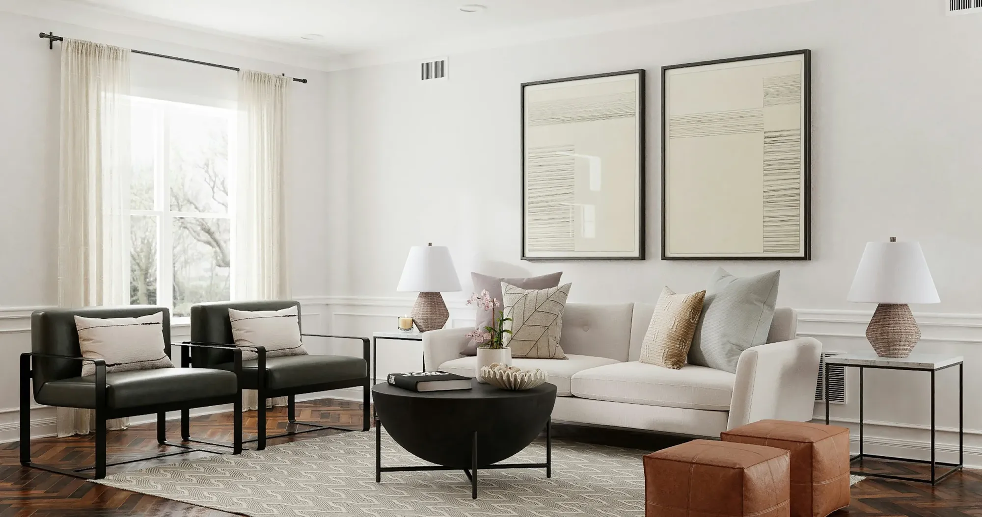 A beautifully arranged living room with a sofa, armchairs and framed art